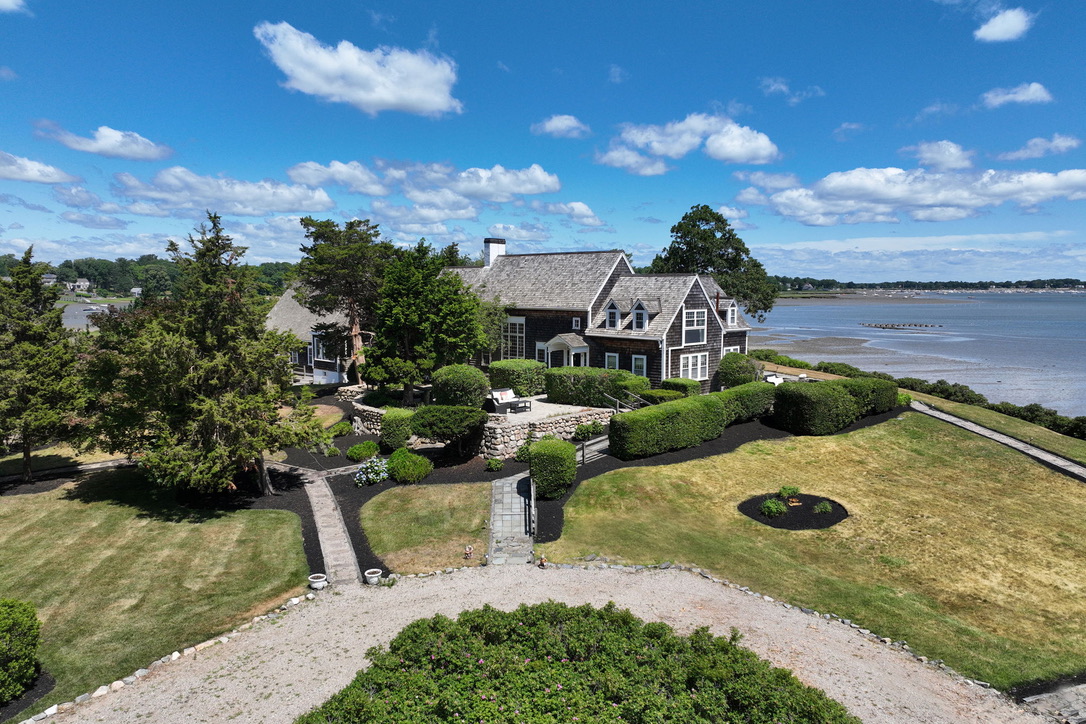 Aerial view of Duxbury Mansion on the water
