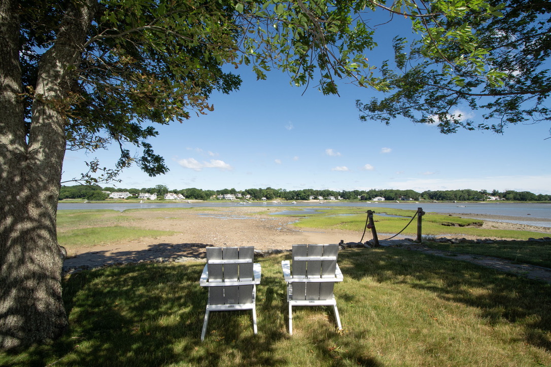 Adirondack chairs overlooking the water